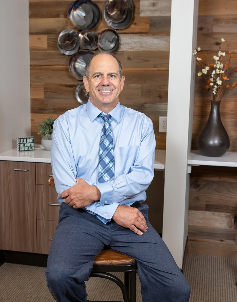 Dr. James Slaman, DDS, seated in his Albuquerque office.